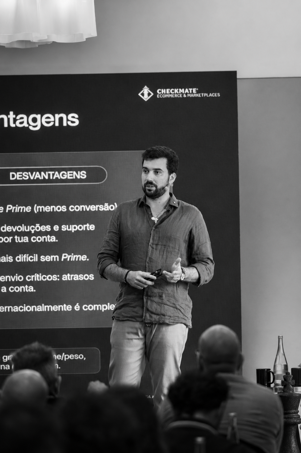 João presenting on stage during an ecommerce marketplace talk.